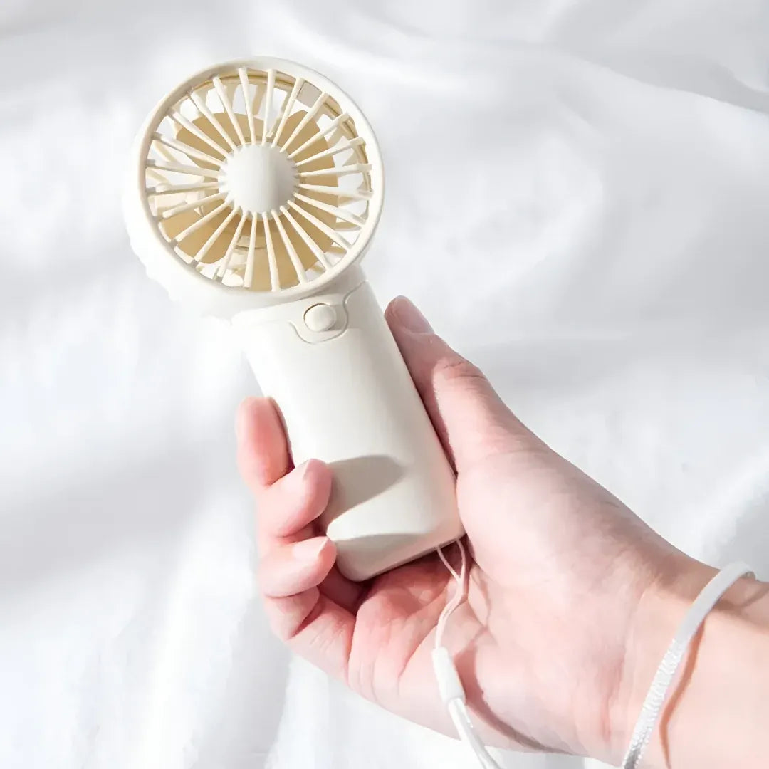 Compact Handheld Cooling Fan with Battery Power for Travel