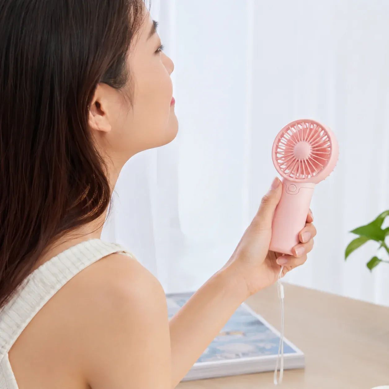 Compact Handheld Cooling Fan with Battery Power for Travel