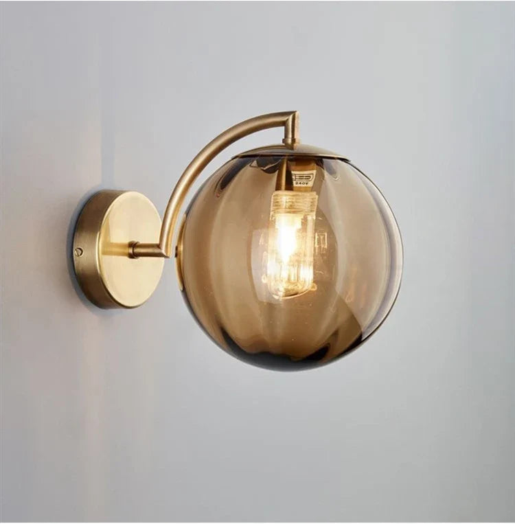 Modern Brass Wall Sconce with Tinted Glass Ball Shade