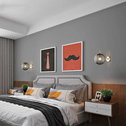 Modern Brass Wall Sconce with Tinted Glass Ball Shade