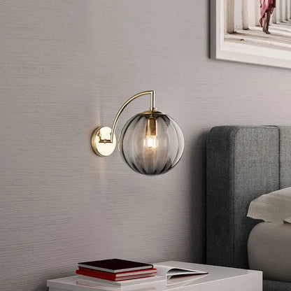 Modern Brass Wall Sconce with Tinted Glass Ball Shade
