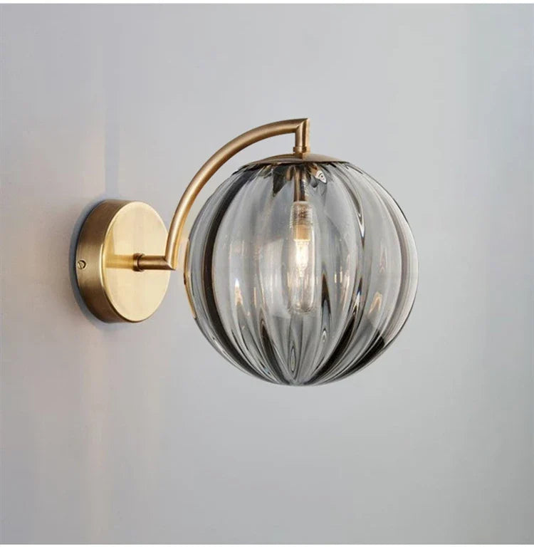Modern Brass Wall Sconce with Tinted Glass Ball Shade